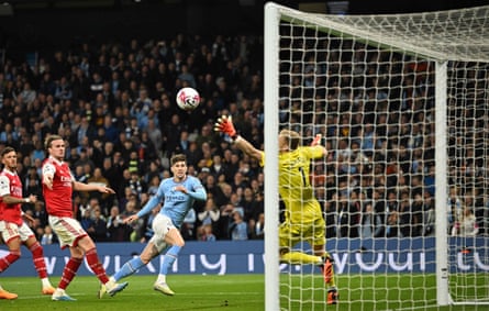 Manchester City’s John Stones scores their second goal past Arsenal’s Aaron Ramsdale.