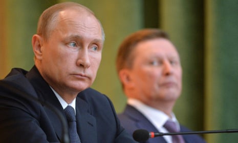 Vladimir Putin fired his chief of staff Sergei Ivanov (background), and replaced him with his deputy.