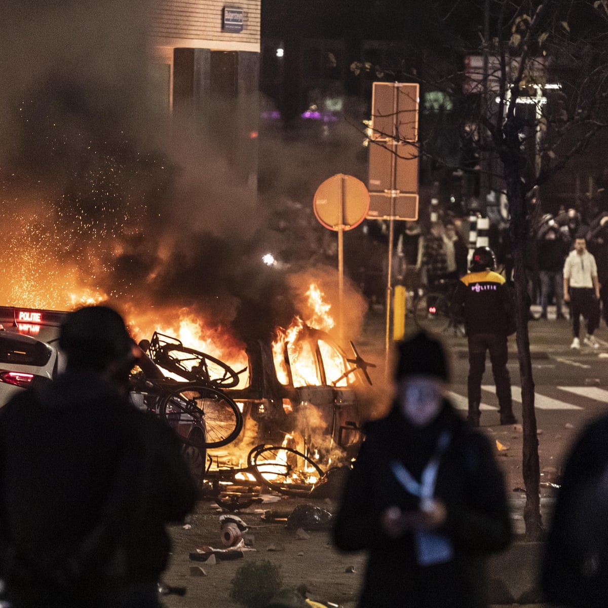 Rotterdam police open fire as Covid protest turns into 'orgy of violence' | Netherlands | The Guardian