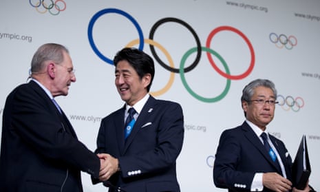Japan’s prime minister Shinzo Abe (centre) shakes hands with IOC president Jacques Rogge as Tokyo 2020 Olympic bid committee president Tsunekazu Takeda stands by after signing the host city contract for the 2020 Games.