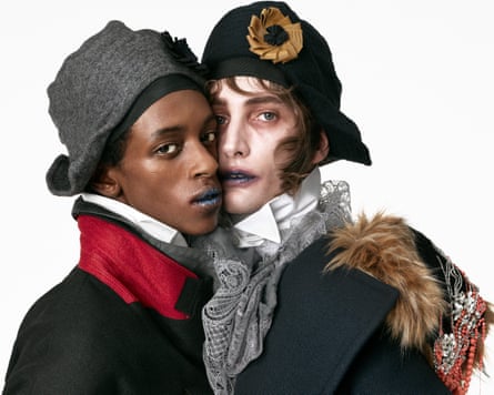 Two models in closeup wearing looks from collection