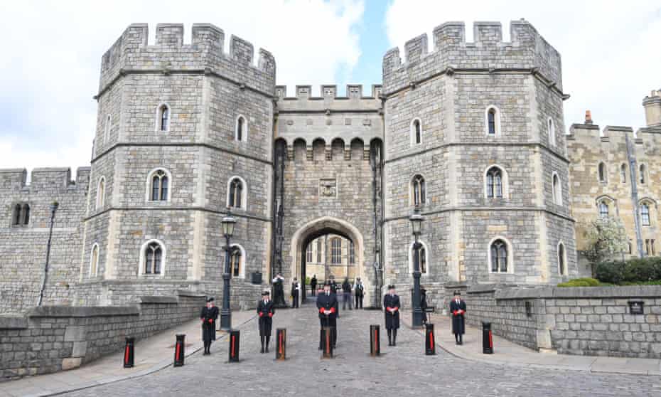 Staff stand outside Windsor Castle following the death of Prince Philip