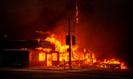 US-FIRE-WEATHER-AFP PICTURES OF THE YEAR 2018<br>-- AFP PICTURES OF THE YEAR 2018 -- A store burns as the Camp fire tears through Paradise, California on November 8, 2018. - A rapidly spreading, late-season wildfire in northern California has burned 20,000 acres of land and prompted authorities to issue evacuation orders for thousands of people. (Photo by Josh Edelson / AFP)JOSH EDELSON/AFP/Getty Images