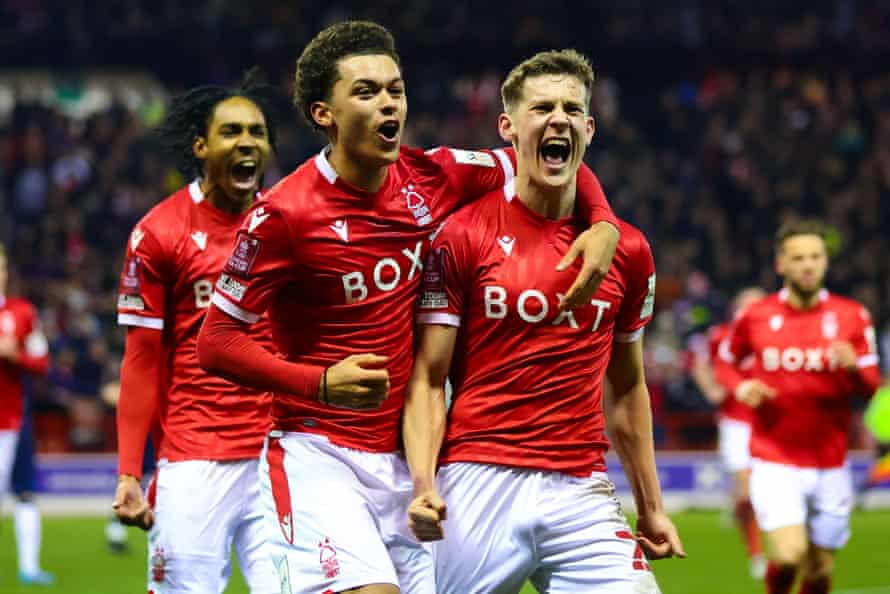 Brennan Johnson puts an arm round Ryan Yates after the midfielder’s winner for Forest against Huddersfield in the fifth round.