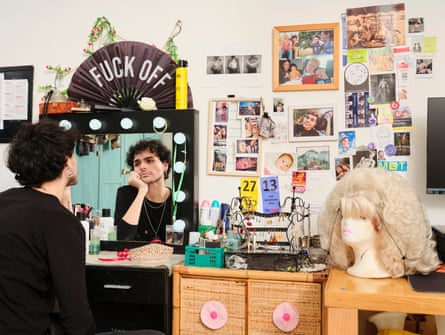 Andrea photographed at a make-up mirror with lights in his room