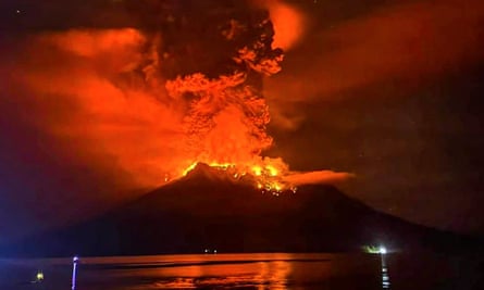 Mount Ruang volcano spewing molten lava and volcanic ash into the air as the increase in volcanic activity is raised from level three to four