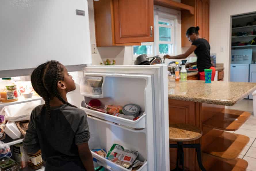 Cherokeena Robinson, 32, makes her son Mai’Kel Stephens, 6, lunch at their transitional house in San Pedro, California that they share with one or two other families at a time. Cherokeena lost her job during the pandemic and now relies on the organization Family Promise to help with housing, childcare, food, and counseling. Cherokeena and her son have been living in the transitional house since June 2020 where she pays $300 a month for rent for a private room until she can figure out her job and find a full private apartment of her own.