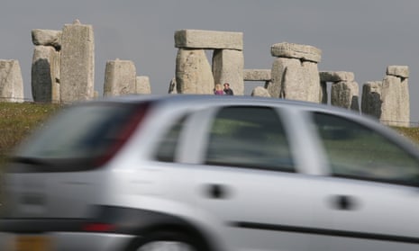 Traffic passes along the busy A303 that runs besides the ancient neolithic monument of Stonehenge.