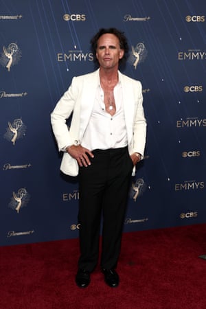 Outstanding supporting actor nominee Walton Goggins (White Lotus) leans into his surprise sex symbol status by opting for a Louis Vuitton dinner jacket, with an open shirt and pendant necklace in place of a tie