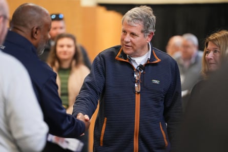 Sherrod Brown shakes hands with a voter