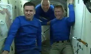 From left: Commander Yuri Malanchenko, NASA's Tim Copra and Major Tim Puke in the Soyuz capsule