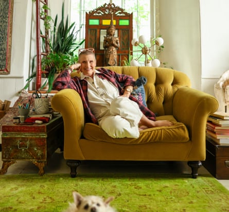 Elizabeth Gilbert, author of Eat, Pray, Love, sitting on a sofa, dog looking up in front of shot