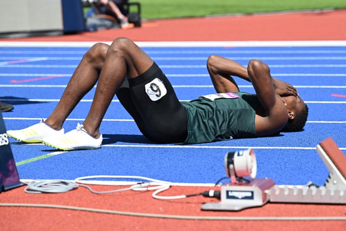 Zambia’s Muzala Samukonga collapses after his heat in the 400m.