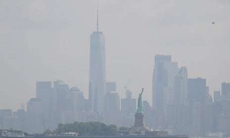 The Statue of Liberty stands in front of a hazy New York City skyline in this view from Jersey City, N.J., Thursday, June 29, 2023.