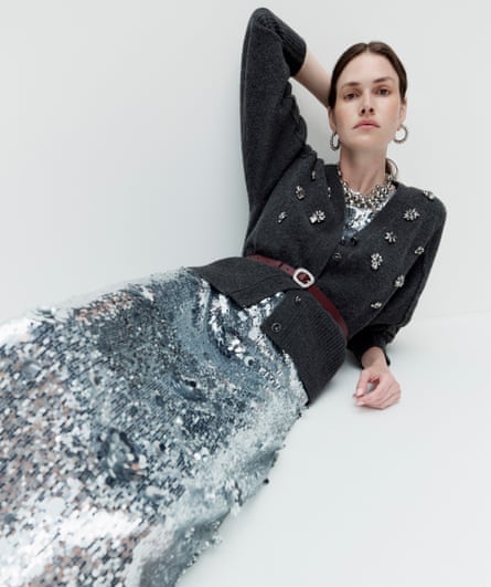 Model in crystal-embellished cardigan and long sequin skirt