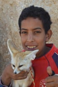 A Mos Espa souvenir seller with his tame desert fox.