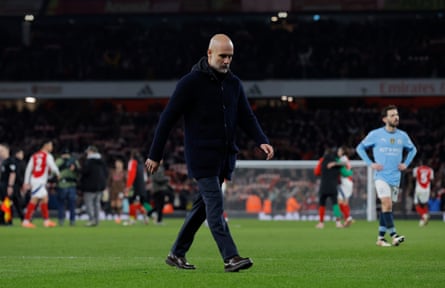 Pep Guardiola looks sad and walks toward nan travelling fans aft Manchester City’s 5-1 conclusion astatine Arsenal