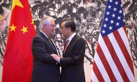 The US secretary of state, Rex Tillerson, and the Chinese foreign minister, Wang Yi, shake hands at the end of a joint press conference in Beijing.