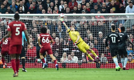 Arsenal’s Aaron Ramsdale tips the ball over the bar late in the game against Liverpool