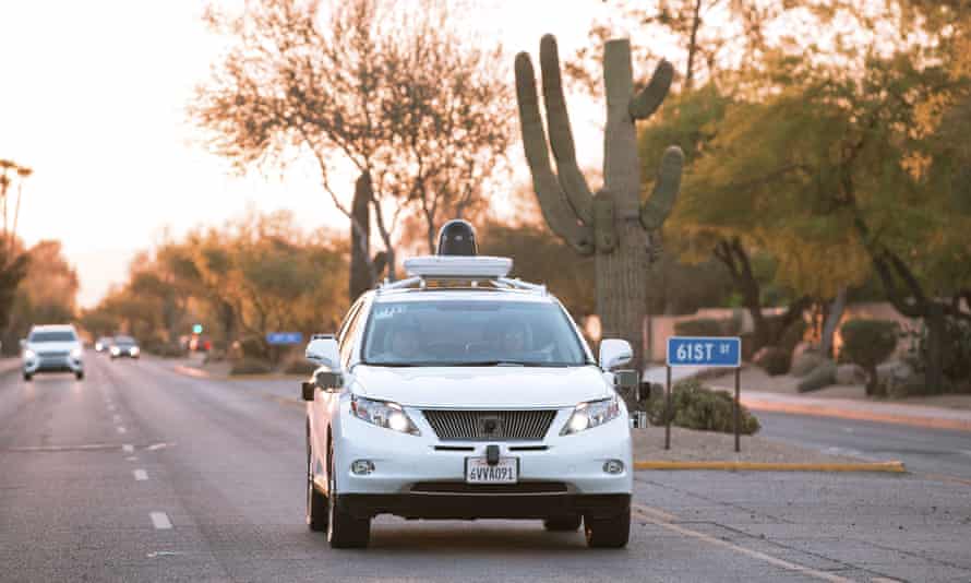 Test drivers use a Lexus SUV, built as a self-driving car, to map the area prior to a journey without a driver in control, in Phoenix, Arizona April 5, 2016.