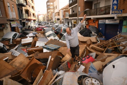 a man walking in debris