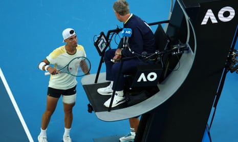 Dino Prizmic remonstrates with the umpire during his first-round match against Serbia's Novak Djokovic at the Australian Open