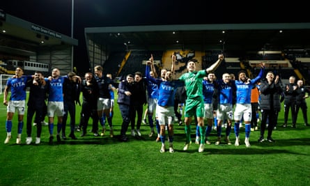 Stockport County’s players celebrate winning the League Two title in style with a 5-2 win at Notts County.