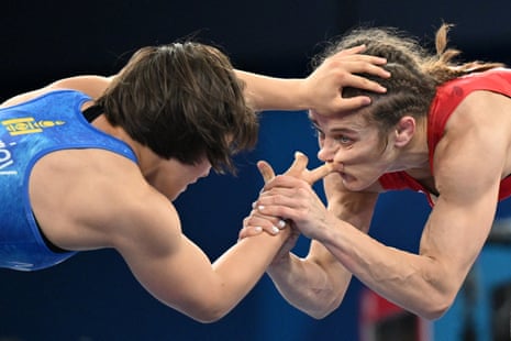 Azerbaijan’s Mariya Stadnik wrestles Mongolia’s Otgonjargal Dolgorjav (L) in their women’s freestyle 50kg quarter-final.