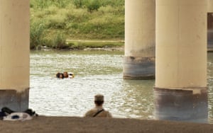 Migrants swim across the Rio Grande as US border cities brace for an influx of asylum seekers when Covid-era Title 42 migration restrictions end in Eagle Pass