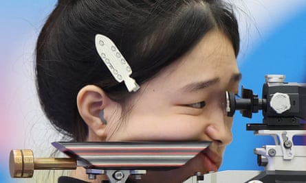 China's Huang Yuting competes in the 10m air rifle mixed team event at Paris 2024.