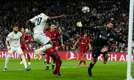Real Madrid’s Vinícius Júnior is denied by Liverpool’s goalkeeper Alisson.