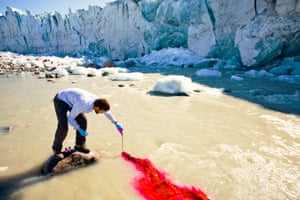 Scientist Ian Bartholomew uses dye tracing techniques as part of a study to measure the speed of the Russell Glacier near Kangerlussuag in Greenland