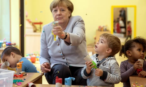 The German chancellor, Angela Merkel, visits a kindergarten in Berlin
