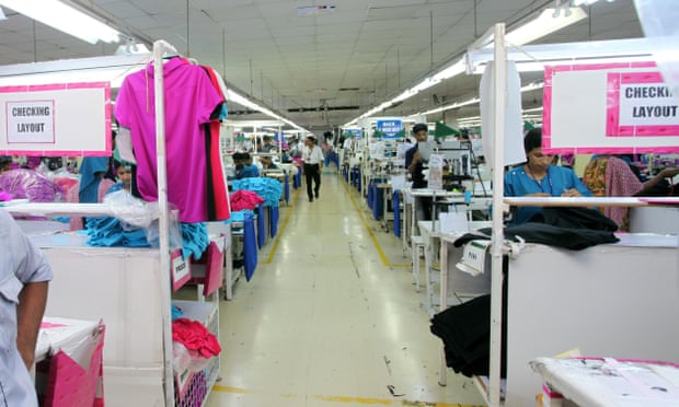 A supervisor stands inside the premises of a Jordan-based garment manufacturer for a top U.S. retailer in Irbid, Jordan. 