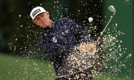 Seamus Power plays a shot from a bunker on the 18th hole during the continuation of the weather delayed second round of the 2023 Masters Tournament.