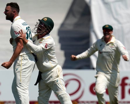 Josh Hazlewood celebrates a wicket with Travis Head during a Test match against South Africa