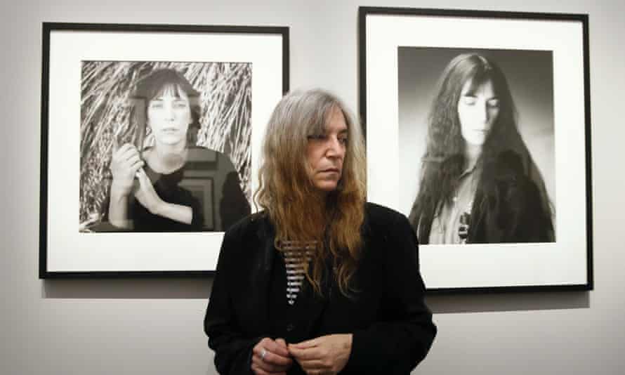 Pattit Smith with portraits of her taken by Robert Mapplethorpe