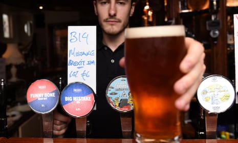 A barman in Dublin proffers a pint of Big Mistake Brexit IPA.
