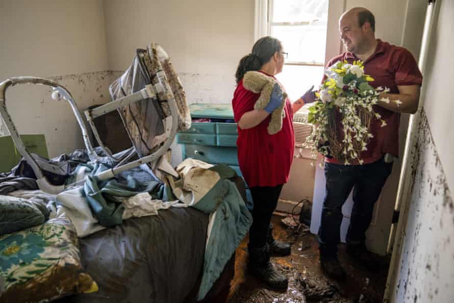Anthony and Vanessa Yates find their wedding wreath in their flood damaged home.