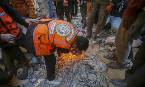A search and rescue under debris of destroyed building, belonged to Palestinians Al Naami family, following the Israeli attack on Maghazi refugee camp.