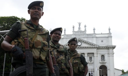 Soldiers stand guard at St Lucia’s cathedral in Colombo, Sri Lanka