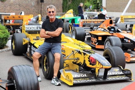Eddie Jordan next to a car