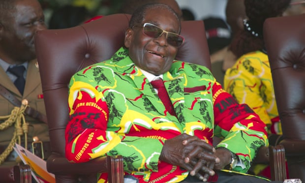 Robert Mugabe smiles during a youth rally