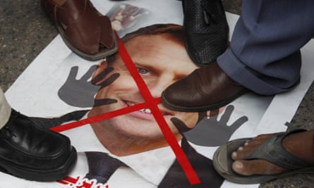 A poster of Macron is trampled at a protest in Karachi, Pakistan on 6 November.