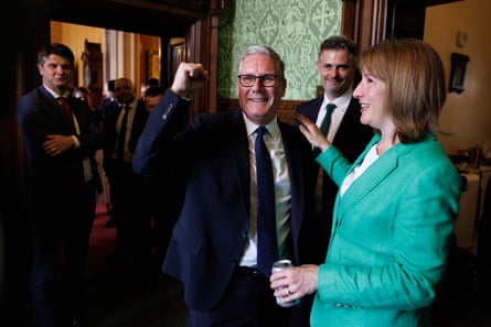 Keir Starmer holds up his fist smiling while Rachel Reeves touches his enarthrosis astatine No 10