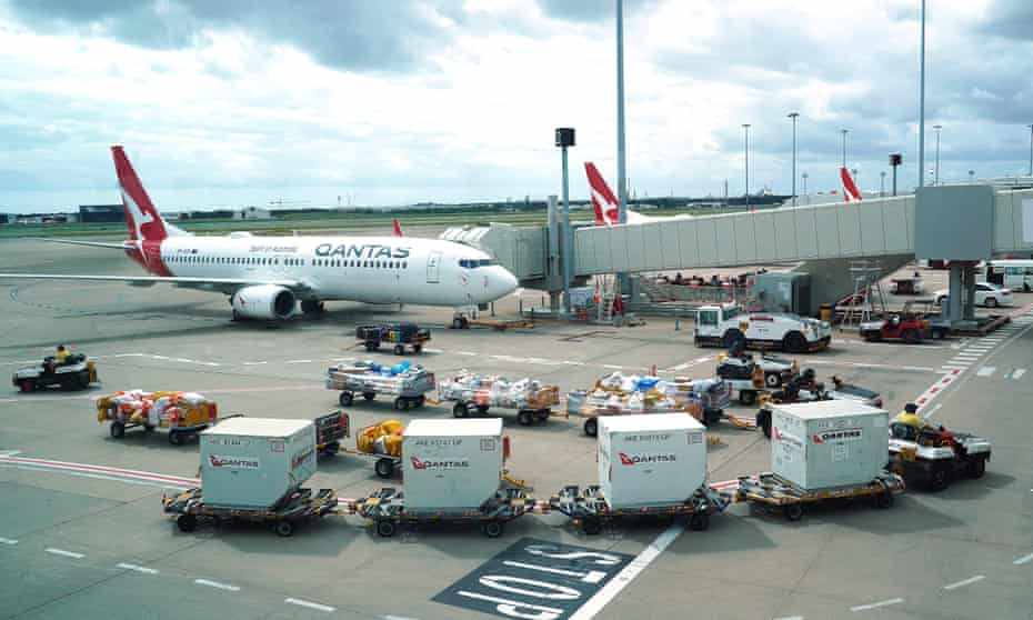 Qantas ground staff are seen operating at Brisbane's domestic terminal