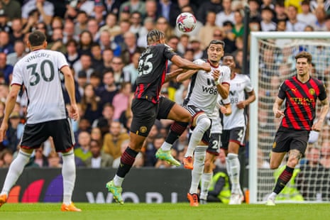 Manuel Akanji of Manchester City and Andreas Pereira of Fulham clash heads.