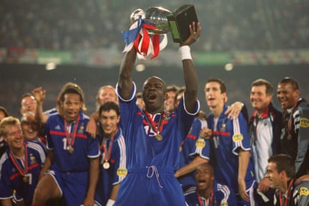 Lilian Thuram celebrates with the trophy after France’s victory at Euro 2000.