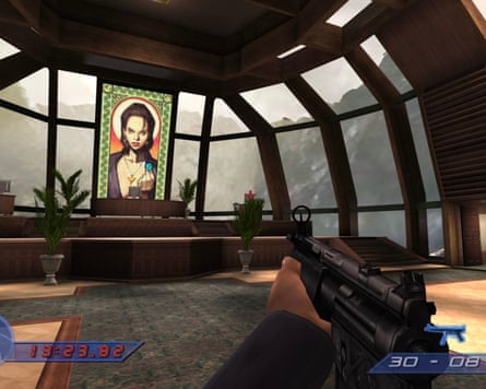Screengrab of a man aiming a machine gun at the image of a woman in a stained glass window