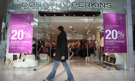 a shopper passes Dorothy Perkins